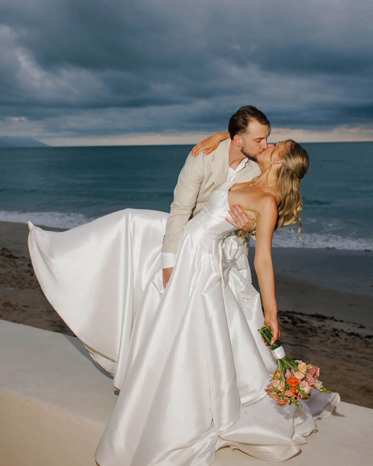 Rainy day wedding portrait on the beach at Hotel Playa Fiesta Puerto Vallarta by Evgenia Kostiaeva